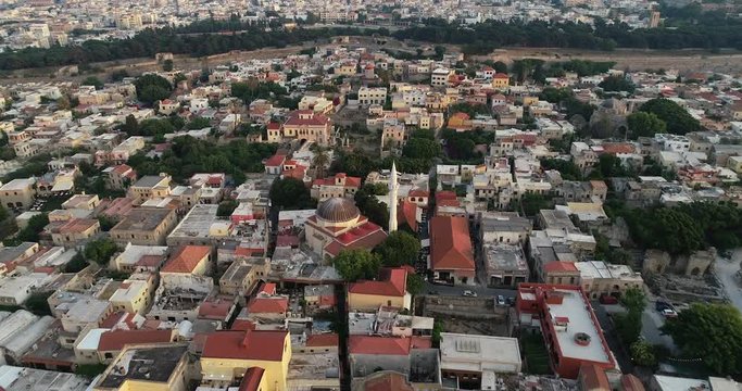 Aerial footage of Rhodes island old fortified town, Palace of the Grand Master, a popular tourist destination, Dodecanese, Aegean, Greece