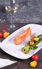salmon with lemon and herbs on plate