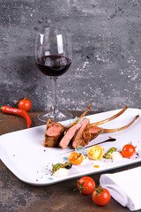 grilled meat and vegetables on plate isolated on white