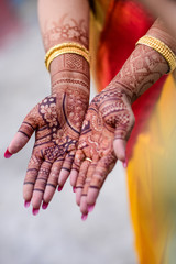 Bengali marriage rituals with beautiful decoration of hand with hena for bride and groom in India