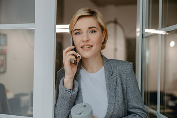 Beautiful young female talking on mobile phone