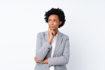 Fototapeta na wymiar African american business woman over isolated white background thinking an idea