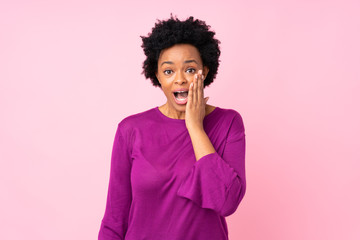 Fototapeta na wymiar African american woman over isolated pink background with surprise and shocked facial expression
