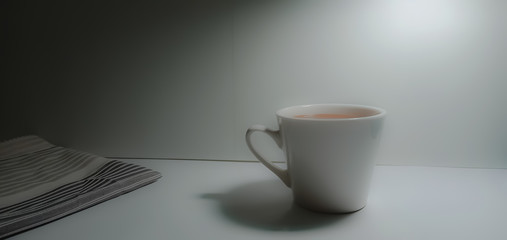 A white coffee mug in a white background