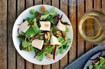 Fresh salad with lettuce, beetroot, walnut and camembert cheese
