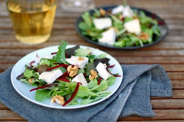 Fresh salad with lettuce, beetroot, walnut and camembert cheese