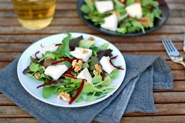 Fresh salad with lettuce, beetroot, walnut and camembert cheese