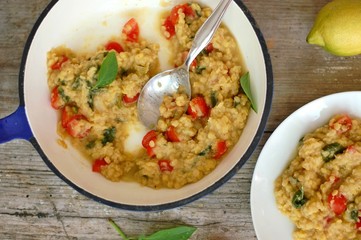 Dry bread spread with paste of red lentils, tomato, basil and lemon
