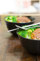Pork burger rice with homemade broccoli for lunch.