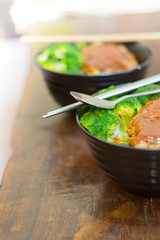 Pork burger rice with homemade broccoli for lunch.