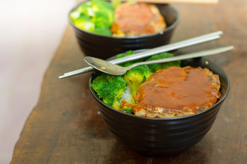 Pork burger rice with homemade broccoli for lunch.