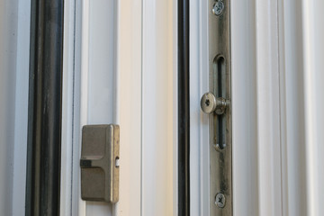Locking point on a tilt and turn aluminum casement window with European groove mechanism