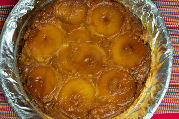 Brazilian apple pie, sweet very famous in Brazil on the wood table kitchen. Top View.