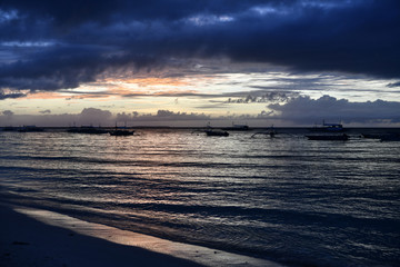 Fototapeta premium sunrise on a tropical island with a white sandy beach in the philippines