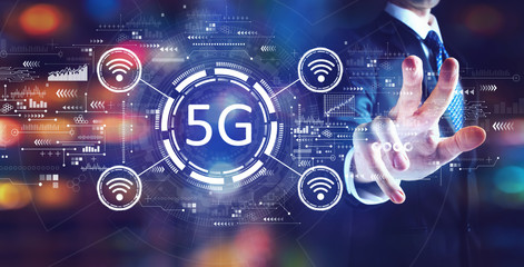 Fototapeta premium 5G network with businessman on night city background