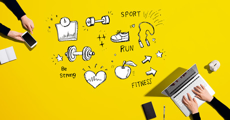 Fitness and diet with people working together with laptop and phone