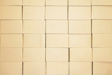 a lot of cardboard boxes are stacked on top of each other