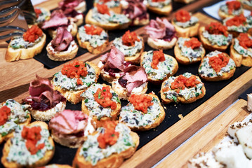Canapes and appetizers on a table, close up. Catering service buffet