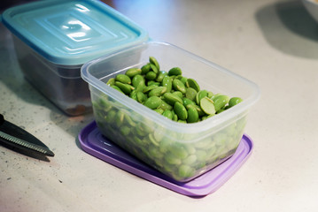 Organic green broad beans. Fresh raw green beans