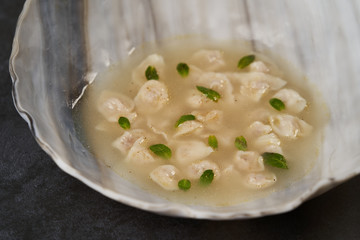Traditional Azerbaijani cuisine, soup with small dumplings with a lot of spices