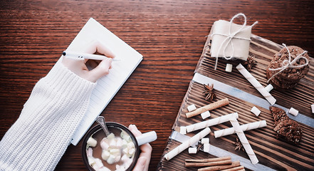 Winter breakfast. A cup of hot chocolate with marshmallows and freshly baked cookies. Gingerbread cookie and coffee.