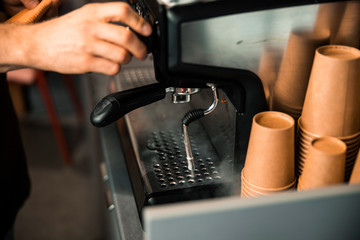 Fototapeta na wymiar Close up of man making an espresso