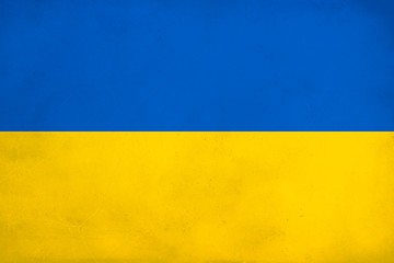 Grunge Flag of Ukraine, Ukraine flag pattern on the concrete wall,  flag of Ukraine banner on scratched vintage texture, retro effect , Background for design in country flag