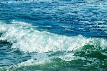 white waves on the turquoise sea close-up