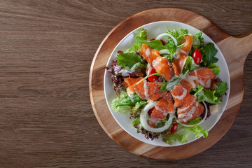 Fresh vegetable salad with smoked salmon