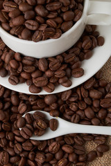 Coffee Cup and coffee beans on the table close-up