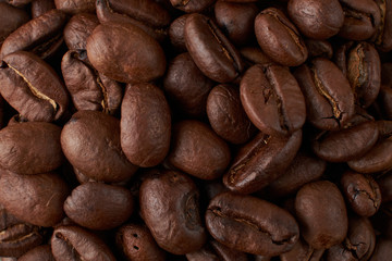 Coffee Cup and coffee beans on the table close-up