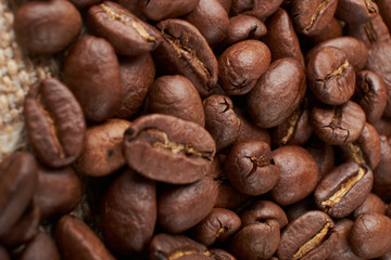 Coffee Cup and coffee beans on the table close-up