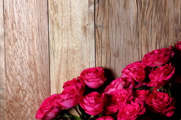 festive background with flowers on a textured surface made of old cracked wood