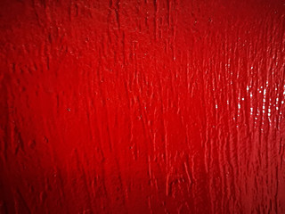 Background of red paint, textured stripes on a blackboard, stains and smudges