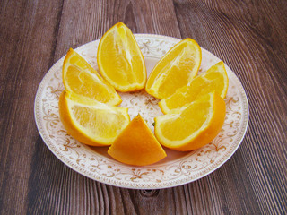 Flower-shaped display Blooming orange on white porcelain plate