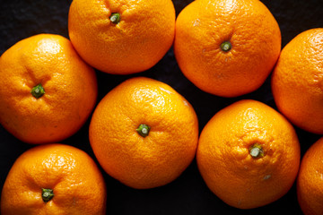 Orange fruit on black background 