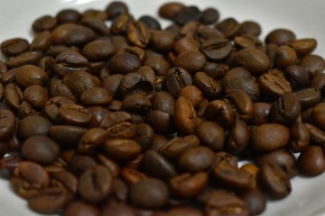 Roasted coffee beans on a substrate.