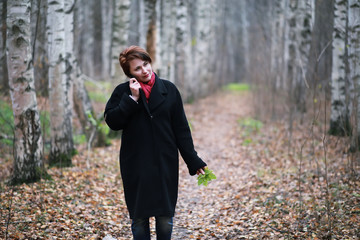 Young girl on a walk in the autumn