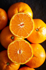 Orange fruit on black background 