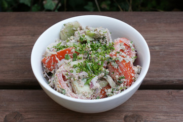 vegetable salad with walnuts. cucumber, tomato and green salad with walnuts