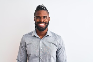 Obraz premium African american businessman with braids standing over isolated white background with a happy and cool smile on face. Lucky person.
