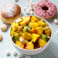 Fruit salad on a colored background
