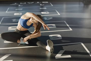 Endurance, patience and workout concept. Determined, focused good-looking athletic female in gym,...