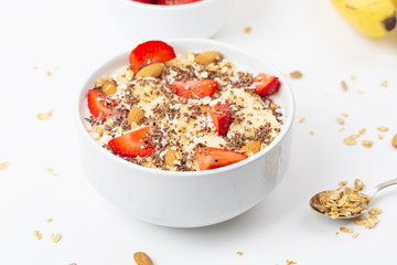 Healthy breakfast, smoothie bowl with granola, chocolate, banana, strawberry and almond. 