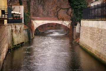 river with old brick bridge background