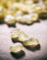 Chios mastic tears on wooden background, closeup view