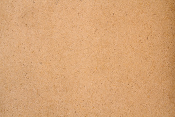 Brown fiberboard closeup texture background. Cartoon texture