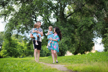 Obraz premium Mom with two daughters twins