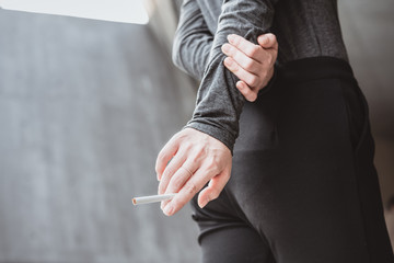 Close-up of female holding cigarette