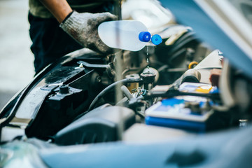  Check water in Car radiator and Add water to car radiator, selective focus